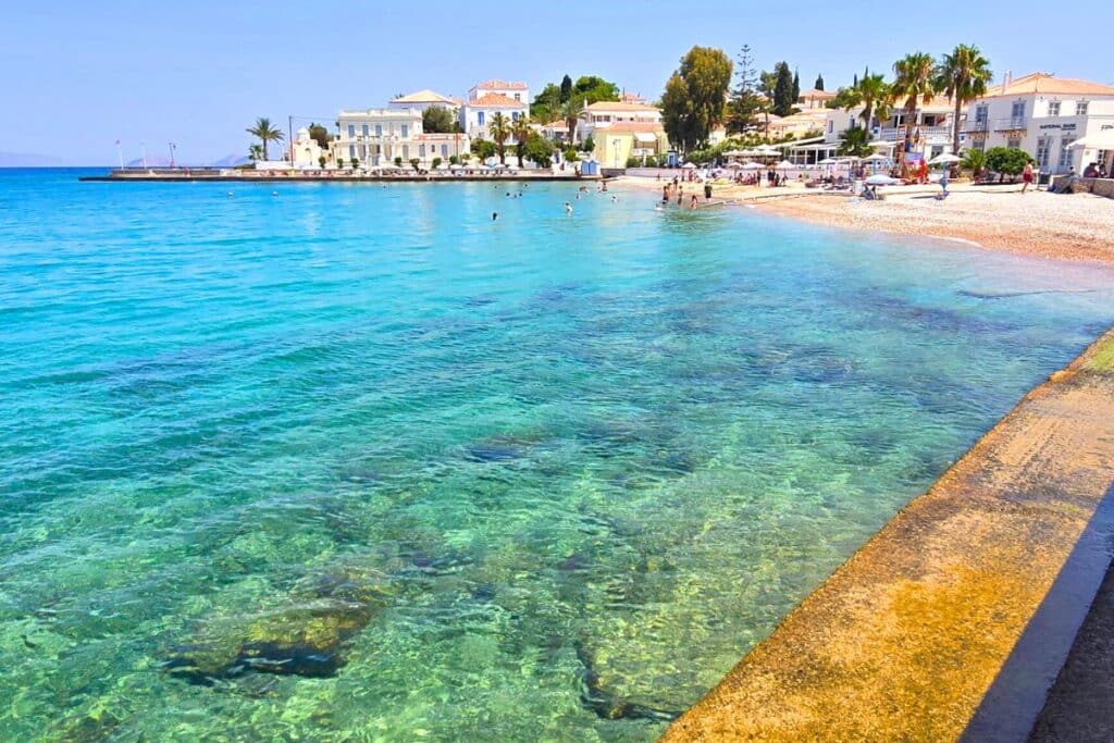 Clear turquoise water and a beach in the main town of Spetses Greece
