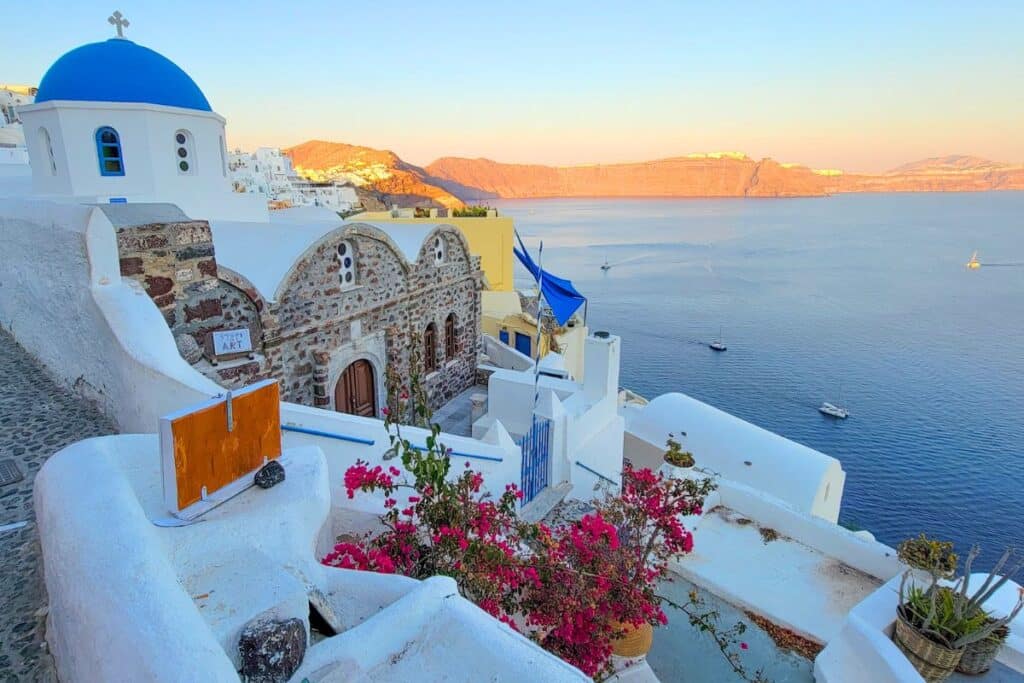 Blue domes of Oia Santorini at sunset