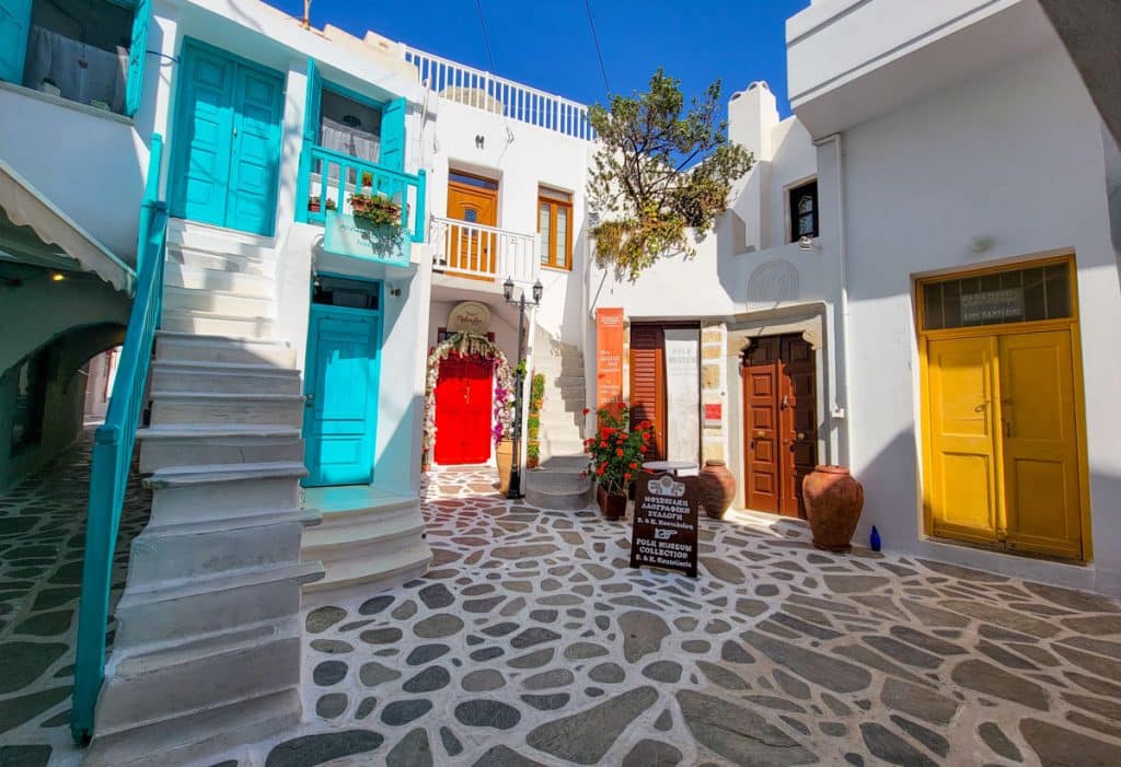 Colorful doors on whitewashed shops in Naxos Town Greece