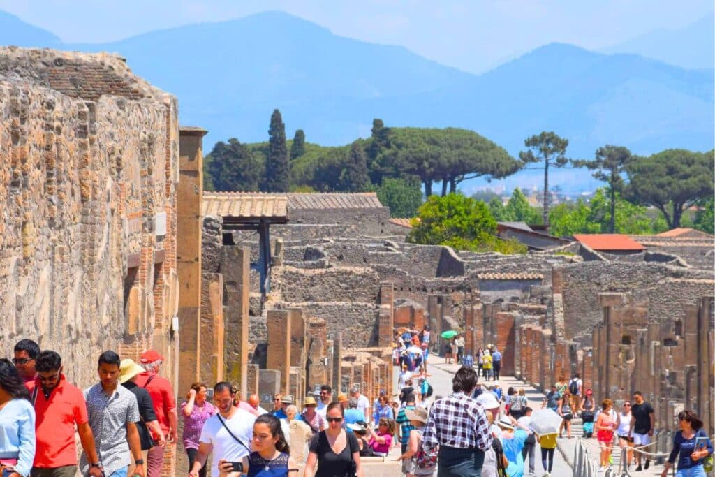 Crowds walking around Pompei Italy on a sunny summer day