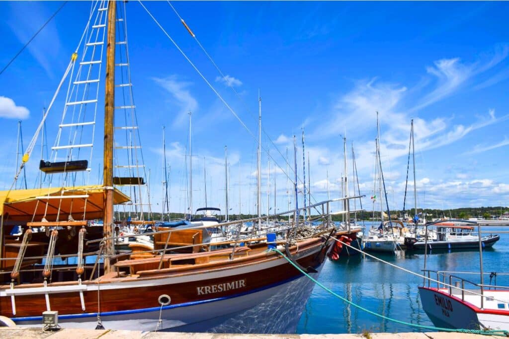 Boats in the Pula Croatia harbor on a sunny day