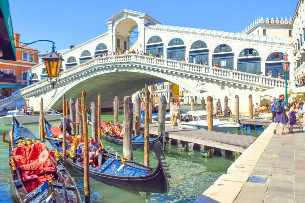 Gondolas docked near the Rialto Bridge in Venice Italy